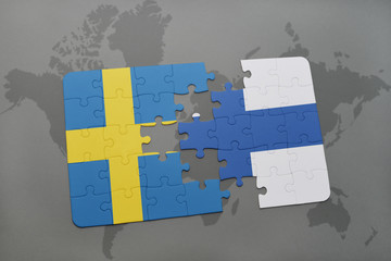 puzzle with the national flag of sweden and finland on a world map background.