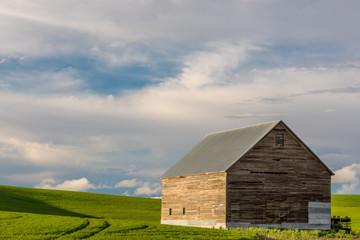 Wood barn with tin roof in the heart of farmland