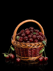 Fototapeta na wymiar Cherry crop in a basket