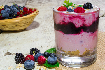 yogurt with fresh berries and oatmeal. healthy dessert