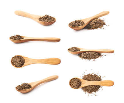 Wooden spoon full of cumin seeds