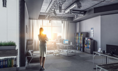 Obraz premium Businesswoman in modern office interior . Mixed media