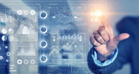 Businessman using innovative technologies . Mixed media