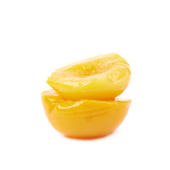 Canned peach half isolated
