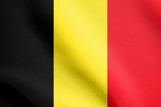 Flag of Belgium waving in wind with fabric texture