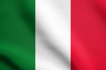 Flag of Italy waving in wind with fabric texture