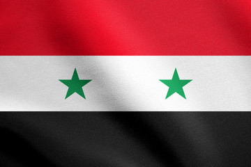 Flag of Syria waving in wind with fabric texture