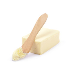 Knife over a piece of butter isolated
