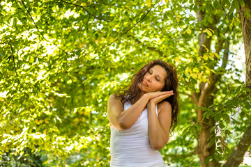 menopausal woman rests on folded hands