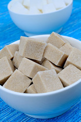 Sugar cubes in bowls