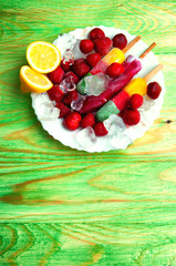 Fruit ice cream and fresh fruits, on a wooden abstract backgroun