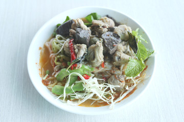 Curry chicken noodles (KHANOM CHIN) with vegetable.