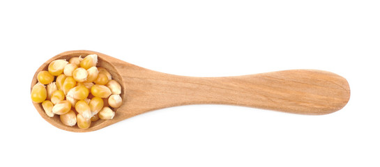 Wooden spoon filled with corn