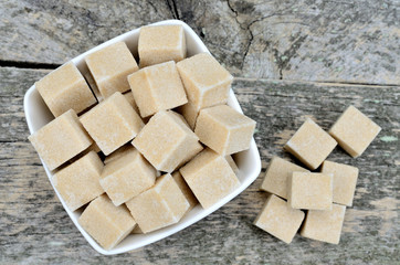 Beige sugar cubes in bowl