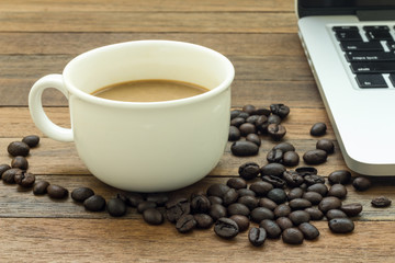 coffee bean ,coffee cup and notebook on morning work