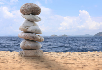 balance rock or zen stones on the beach.