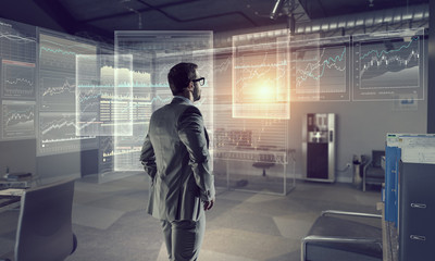 Businessman in modern office  . Mixed media