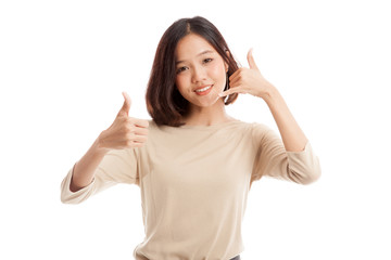 Young Asian woman thumbs up show with phone gesture