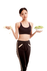 Beautiful Asian healthy girl with measuring tape and salad