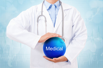 Doctor holding blue crystal ball with medical sign on blue background.