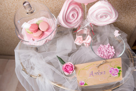 Decorazioni battesimo con palloncino, alzatine, fiocchi, dolci, fiori e tulle  