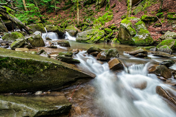 small cascades on the river among bouders