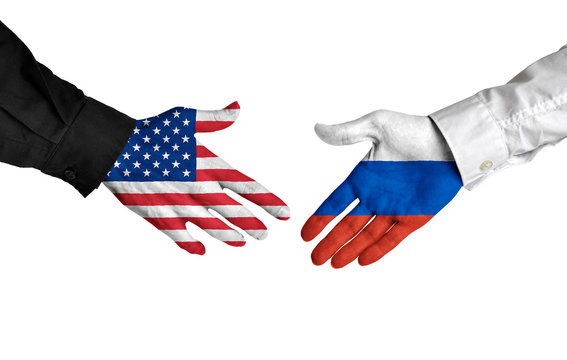United States and Russia leaders shaking hands on a deal agreement