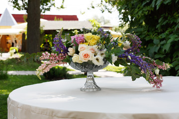Fototapeta na wymiar Beautiful flower bouquet outdoors. Wedding floristic decoration 
