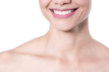 Smiling woman, cropped image. Closeup shot.