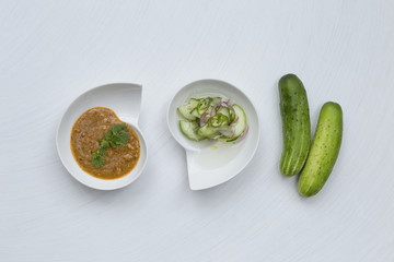 Cucumber salsa and peanut sauce for pork satay 