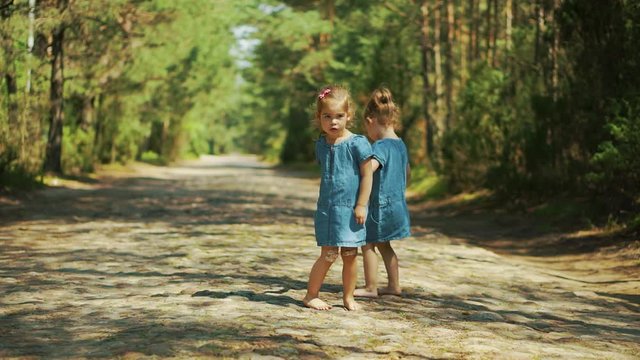 Cute girls walking in the woods