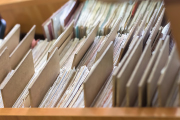 File folders in a file cabinet, card catalog in a library, close