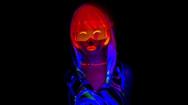 dancer in fluorescent clothing glow