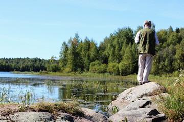 spinning fisherman lake landscape