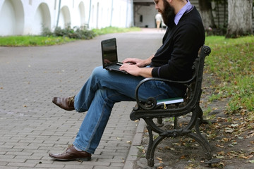 man reading books in the park