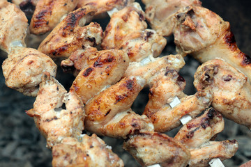 Chicken on the grill to cook