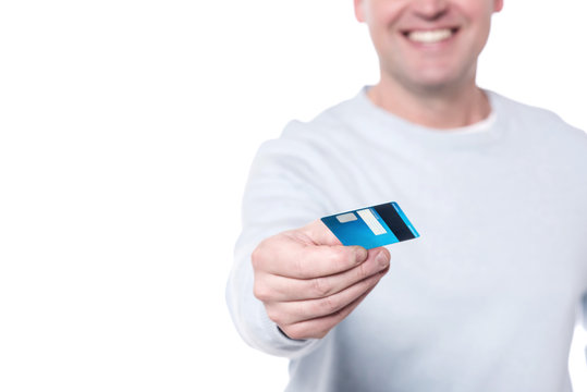 Man offering you credit card, cropped image.