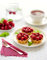 Fruit raspberry tart cakes on a table