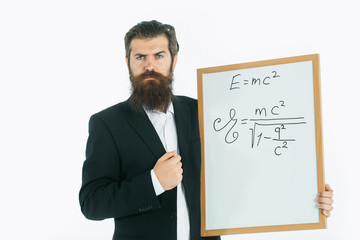 bearded man with einstein formula and newtons law