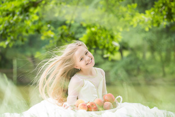 small girl in dress with fruit basket