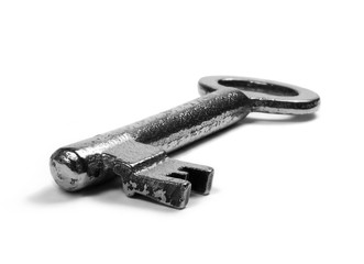 Old, antique key. Close-up shot, isolated on white background.