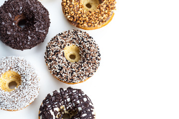various donuts on white background