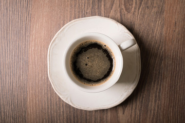 Cup of coffee on wooden