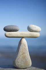 To weigh the pros and cons. Balance of stones.