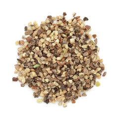 Organic Black pepper (Piper nigrum) peppercorn in big cut size. Isolated on white background. Macro close up. Top view.