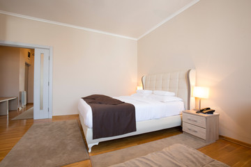 Fototapeta premium Modern elegant hotel bedroom interior