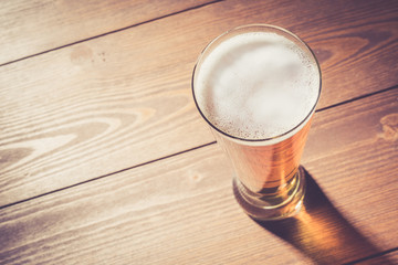 Beer glass on wooden table