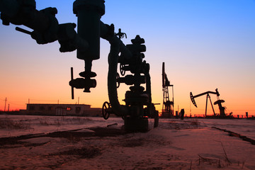 In the evening of oilfield pipeline silhouette