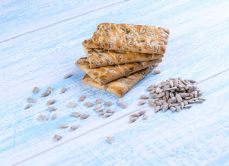 cookies with sunflower seeds on blue wooden table