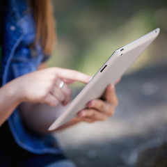 Young Woman, Girl Working With Tablet in Green Field, Park